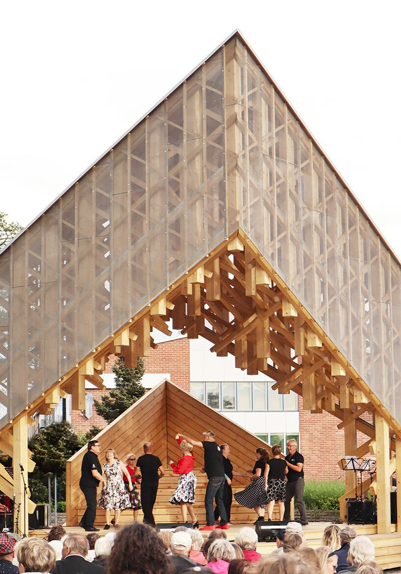crystalline timber canopy inspired by snow fractals becomes a gathering space in finland