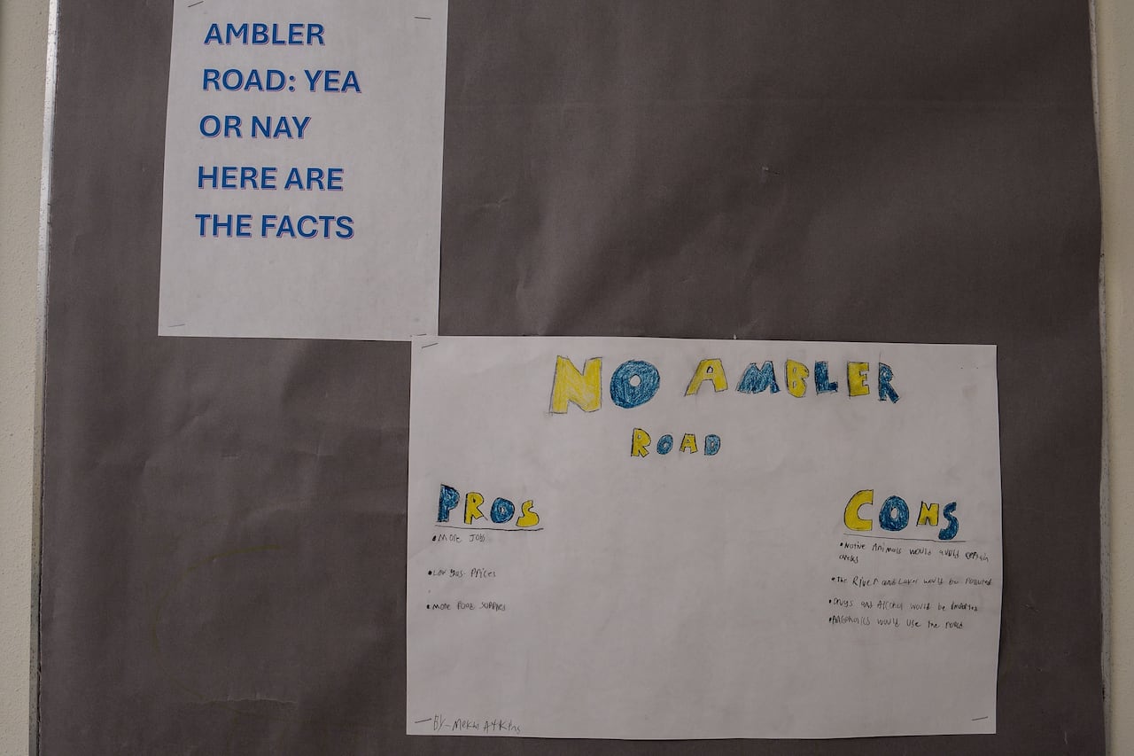 Papers stuck to a wall.