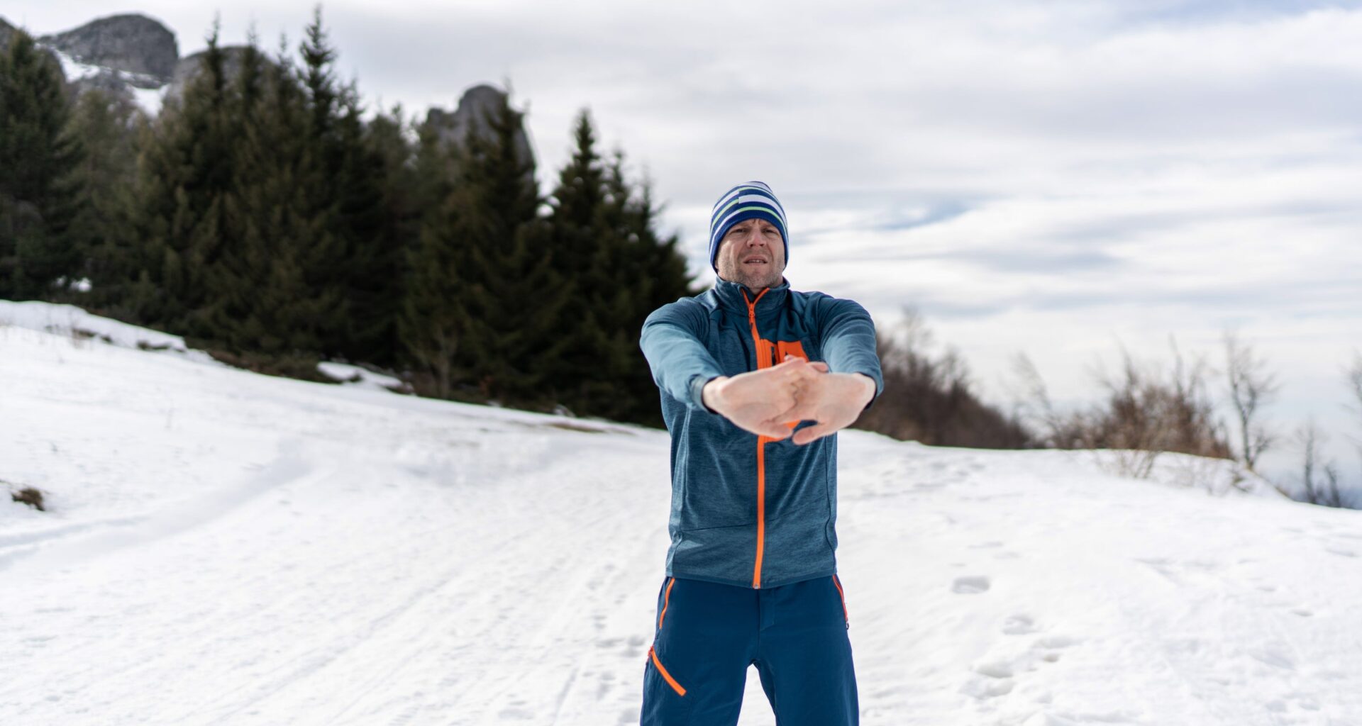 Hiker stretching arms