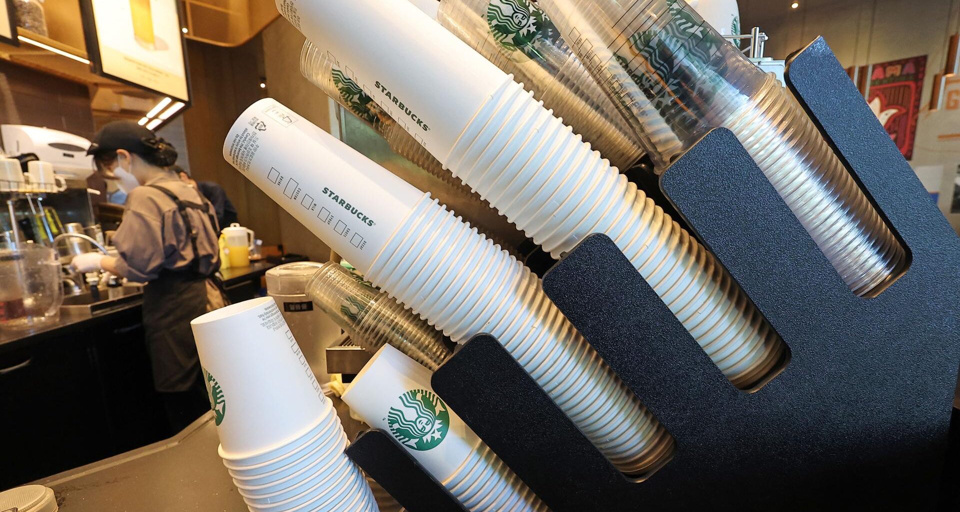 Stacks of disposable takeaway cups are seen at a franchise café in Seoul, Sept. 7, 2023. Yonhap