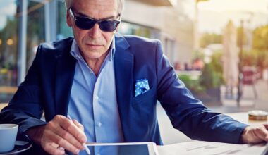 Businessman is working with digital tablet in the cafe stock photo