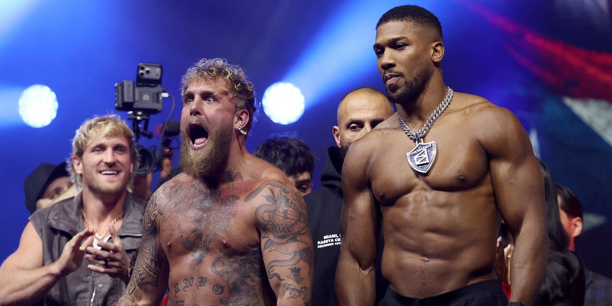 Anthony Joshua weighs in almost two stone heavier than Jake Paul as Briton makes throat-slitting gestures