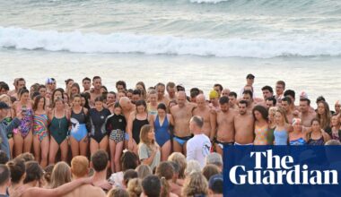 A swim for unity at Bondi beach, the scene of Sydney’s darkest day. But on land tensions fray | Bondi beach terror attack