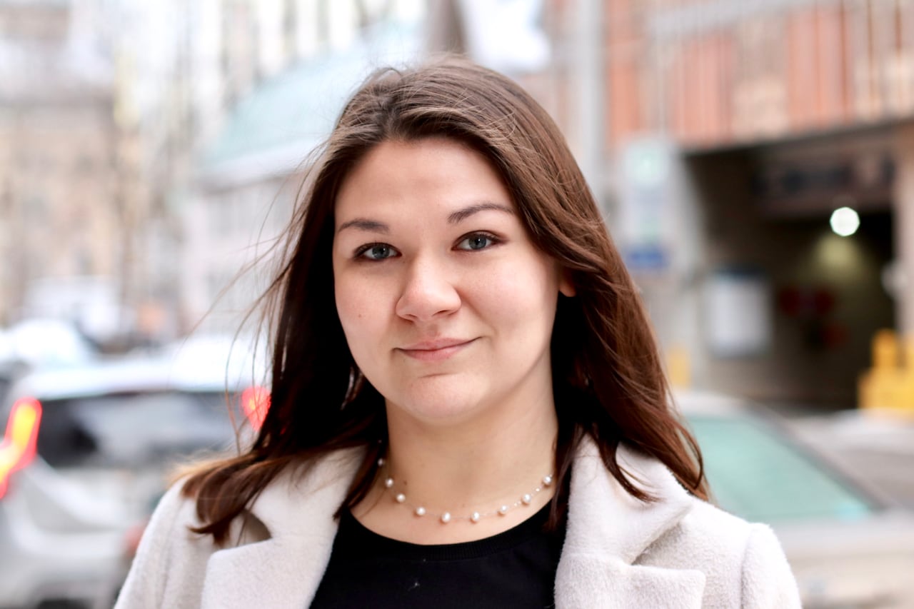 Woman stands on a city street