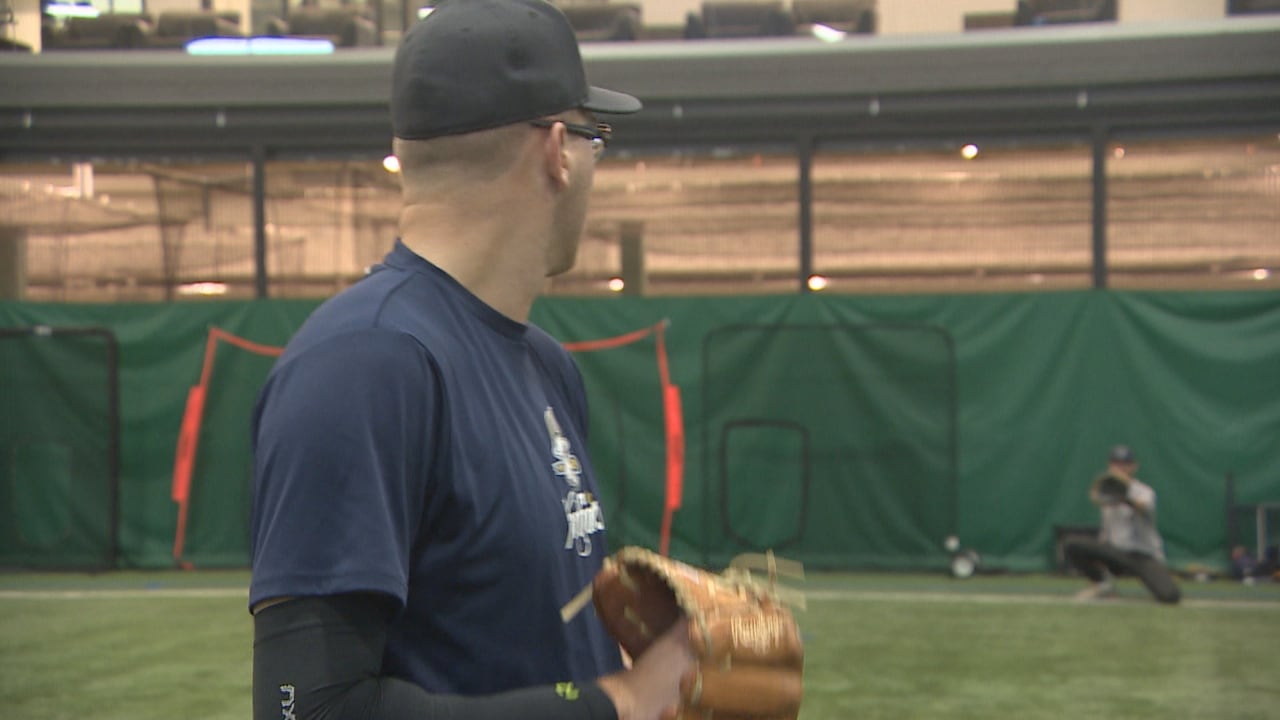 A pitcher throws to a catcher.