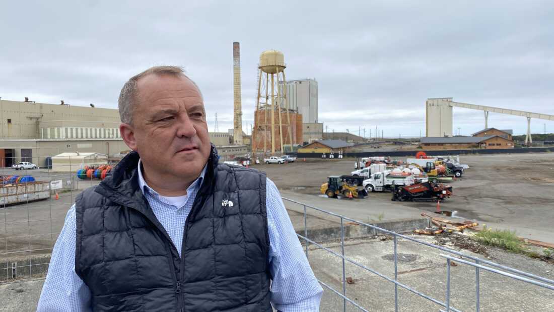 Chris Mikkelsen, executive director of the Humboldt Bay Harbor District, stands on the site of a planned marine terminal in Eureka, Calif. that will assemble wind turbines. The Trump administration recently canceled more than $426 million in federal grants for the port.