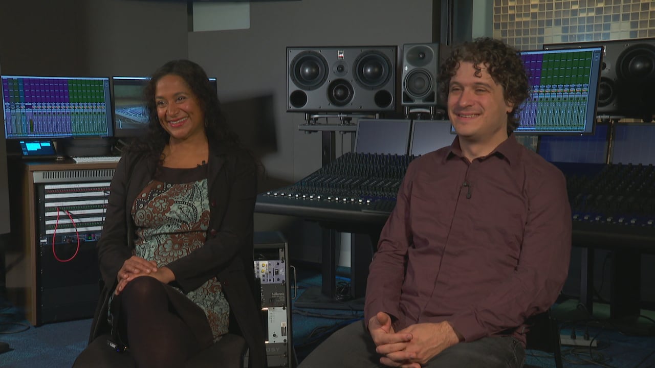 Suba Sankaran and Drew Jureka sit in and speak to a reporter at an audio studio at Humber Polytechnic.