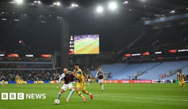 Photo of the match taking place in the Aston Villa stadium with empty stands seen in the background