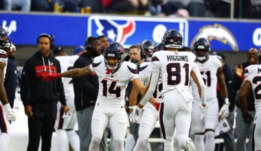 Iowa State cardinal helmet next to football.