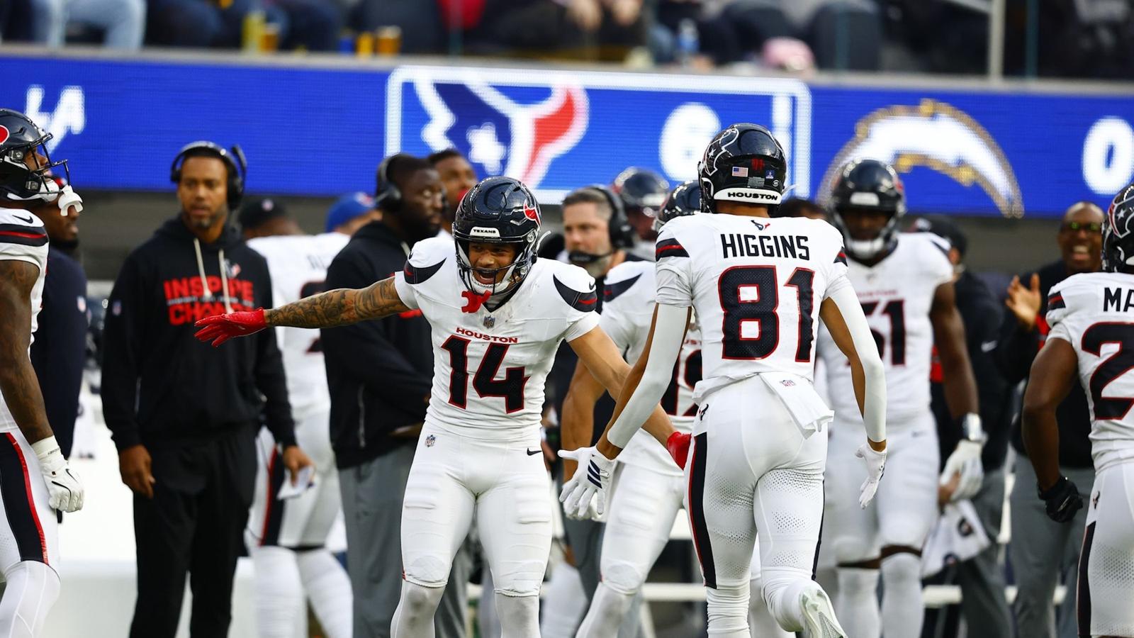 Iowa State cardinal helmet next to football.