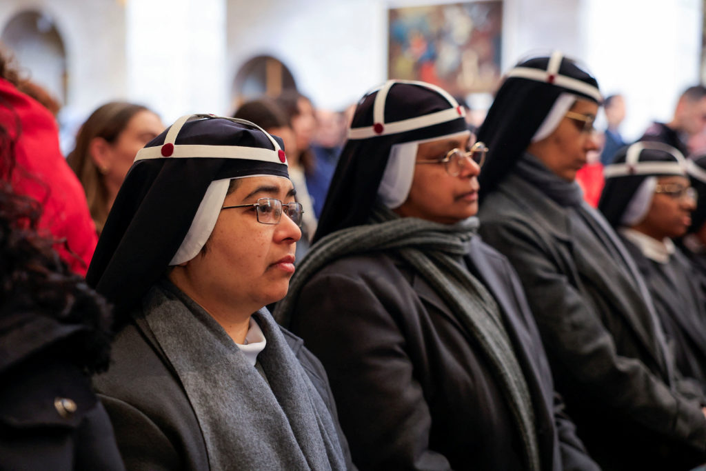 Christian worshippers attend Christmas morning Mass at the Nativity Church