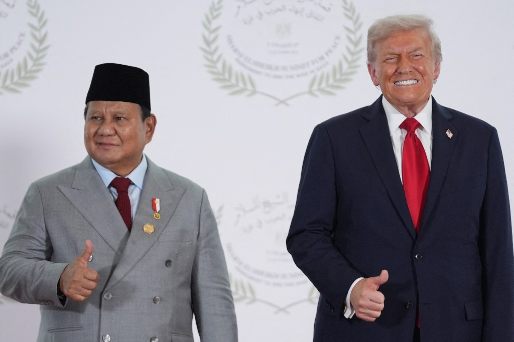 US President Donald Trump greets President Prabowo Subianto during a summit on Gaza in Sharm el-Sheikh on October 13, 2025. Trump landed in Egypt on October 13 for a summit on Gaza, following a lightning visit to Israel after a ceasefire he brokered entered into force.