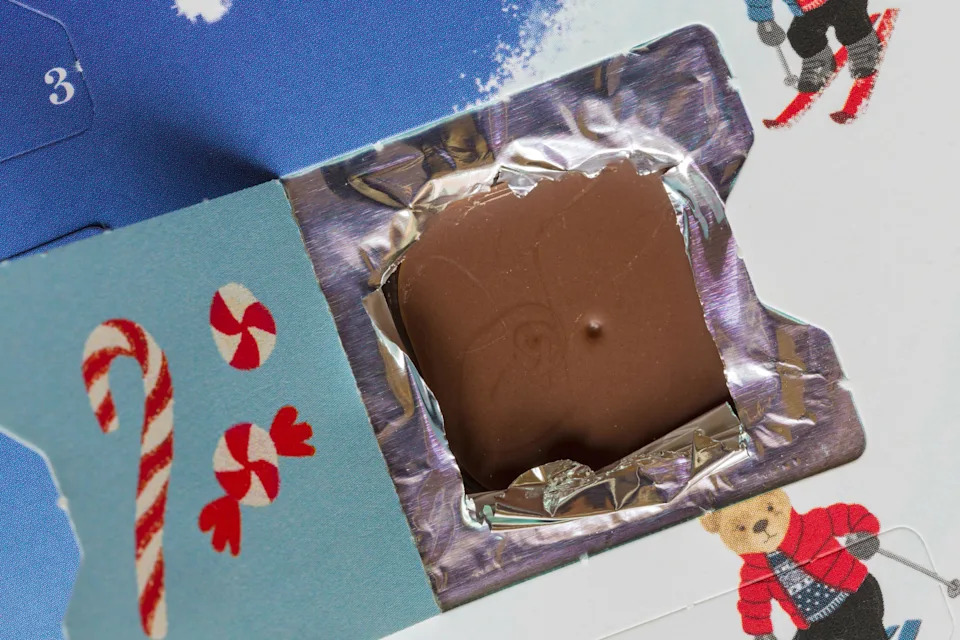 Open door open window on Spencer Bear Advent Calendar from M&S showing chocolate foil