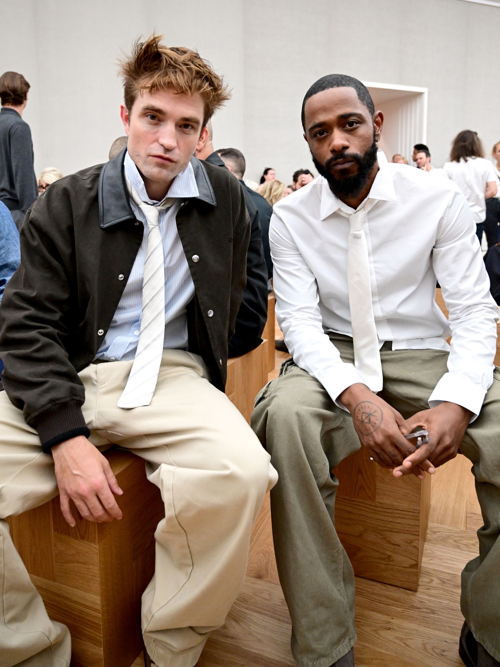 Image may contain Robert Pattinson Keith Stanfield Blazer Clothing Coat Jacket Shirt Accessories and Formal Wear