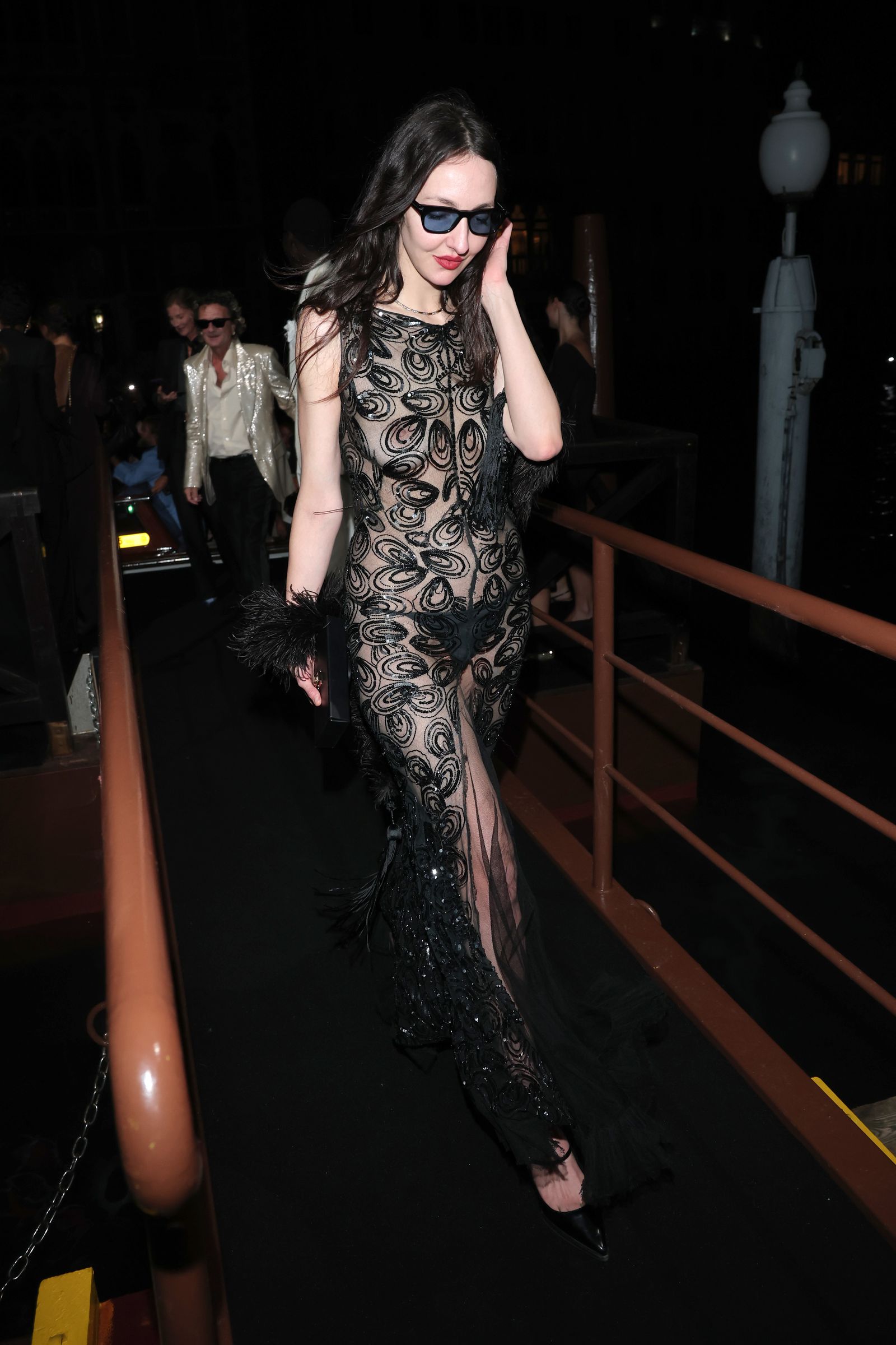 Image may contain Clothing Dress Urban Formal Wear Fashion Evening Dress Adult Person Face Head and Photography