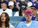 Justin Bieber and Hailey Bieber watch Game 3 of the 2025 World Series between the Toronto Blue Jays and the Los Angeles Dodgers at Dodger Stadium on Oct. 27, 2025 in Los Angeles.