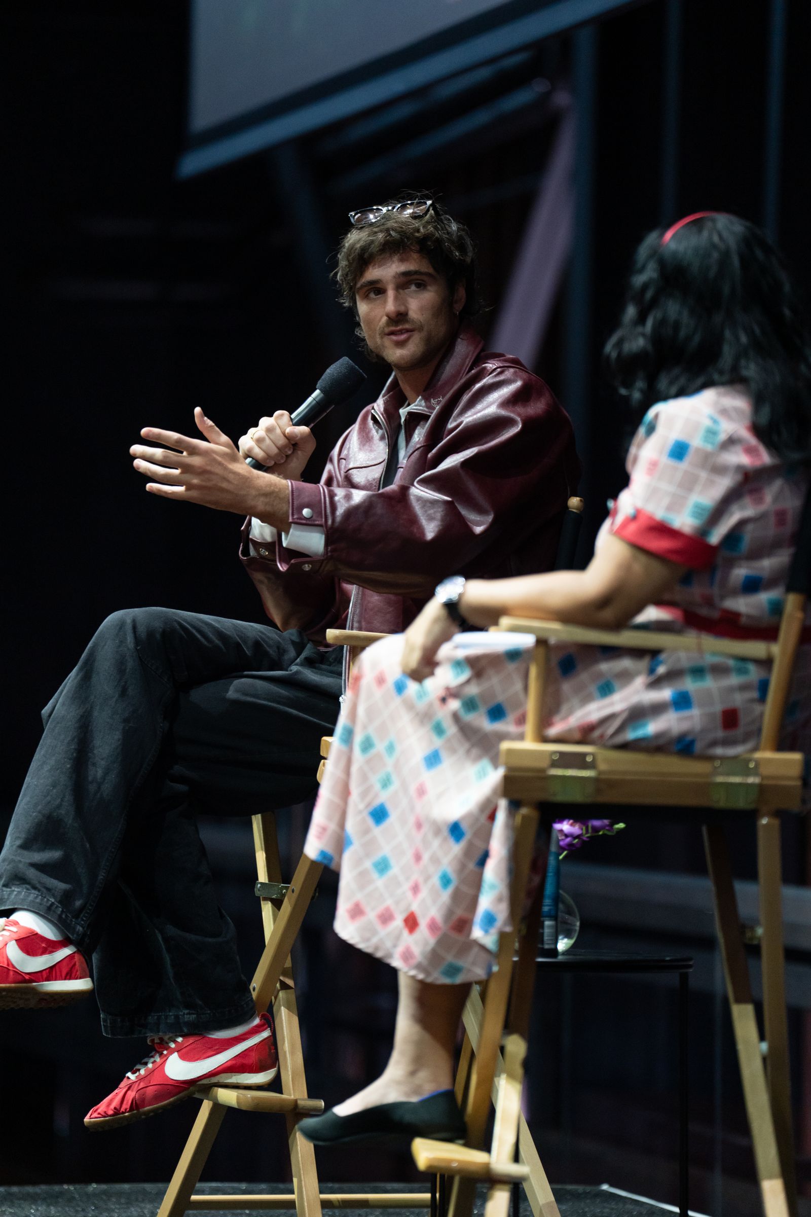 Image may contain Adult Person Electrical Device Microphone Clothing Footwear Shoe Wristwatch Chair and Furniture