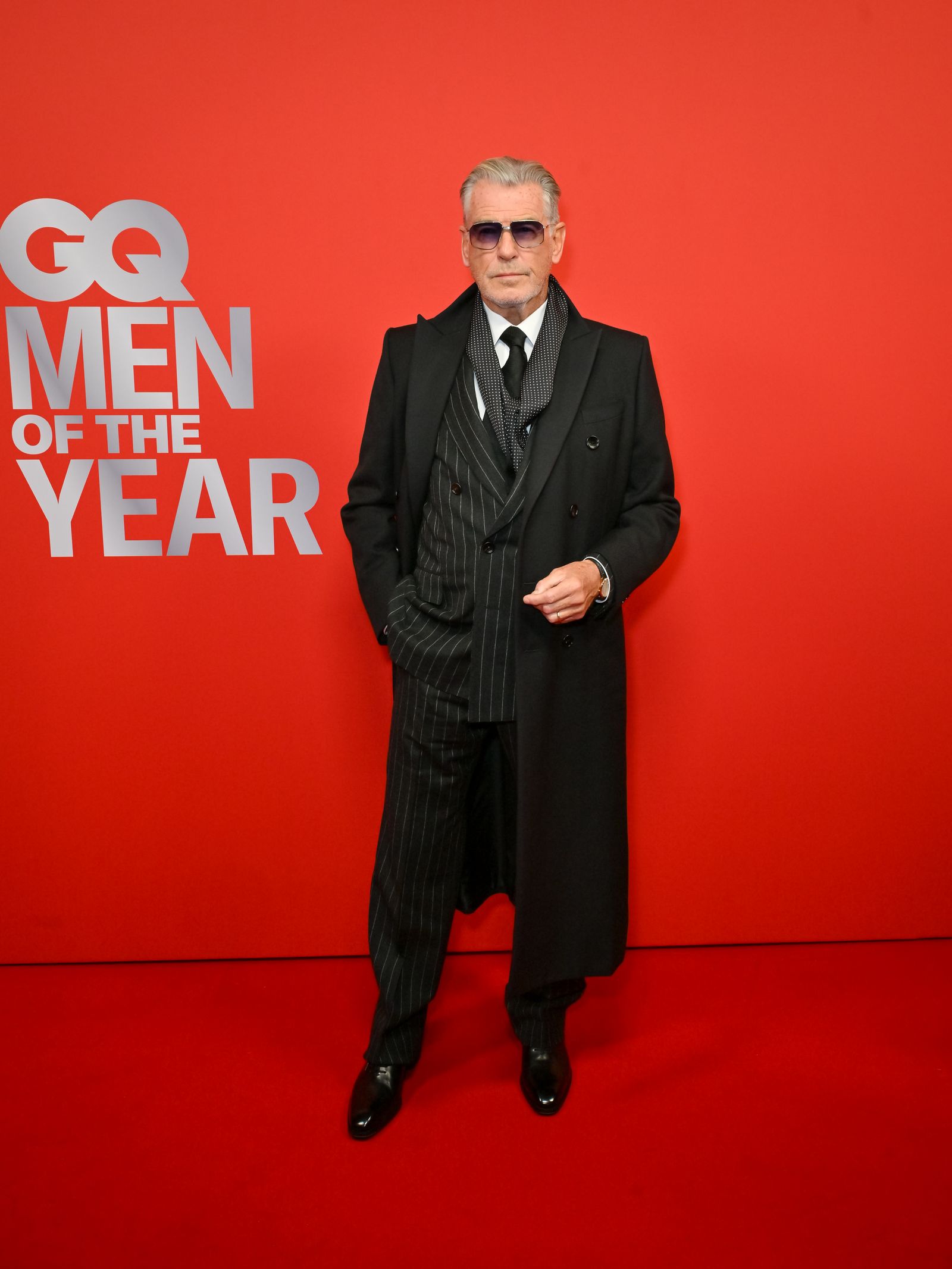 Image may contain Pierce Brosnan Clothing Formal Wear Suit Fashion Coat Adult Person and Standing