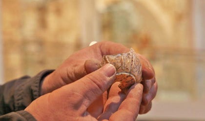 A fragment of a glass vessel discovered during the excavation.