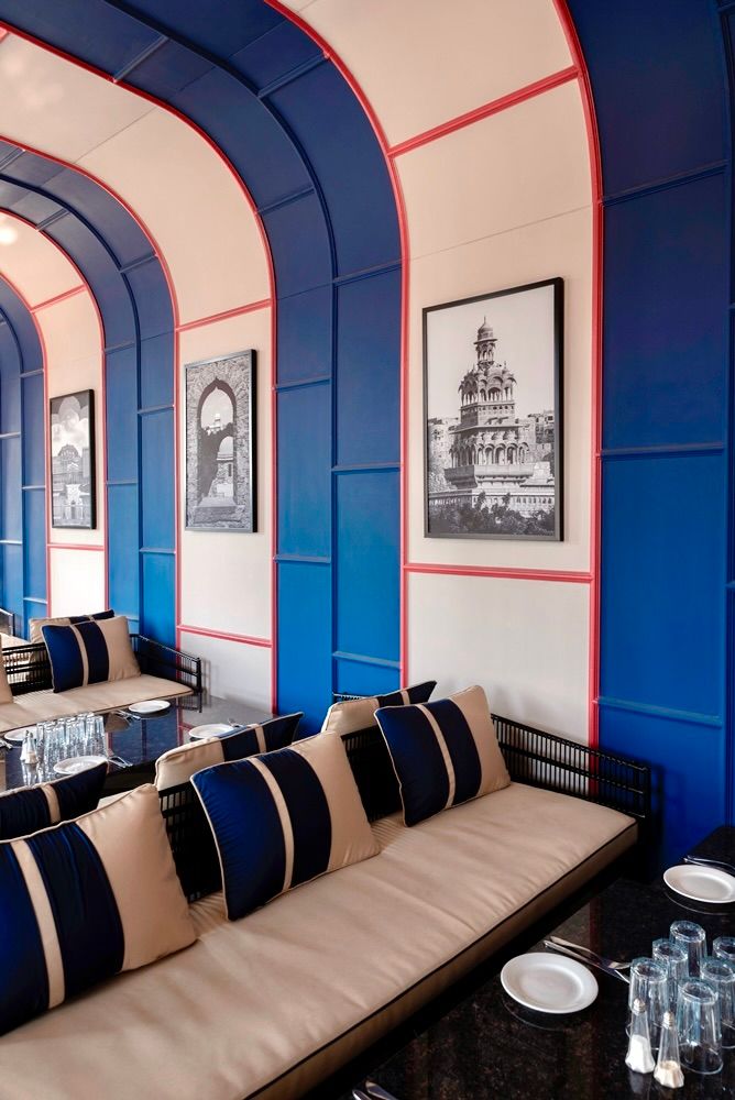 Image may contain Architecture Building Furniture Indoors Lounge Couch Art Painting Home Decor Plate and Person...