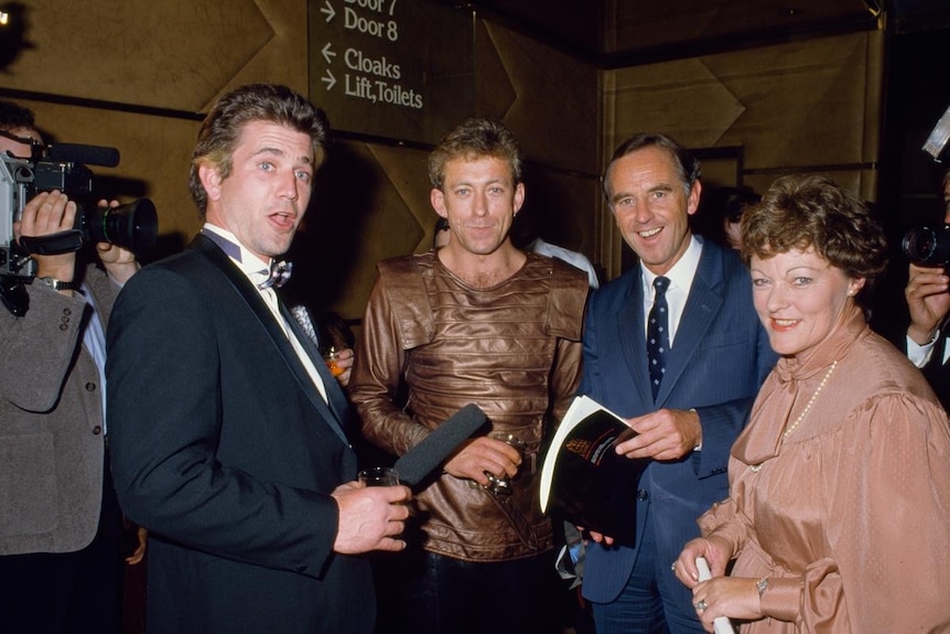 Four people at an event.