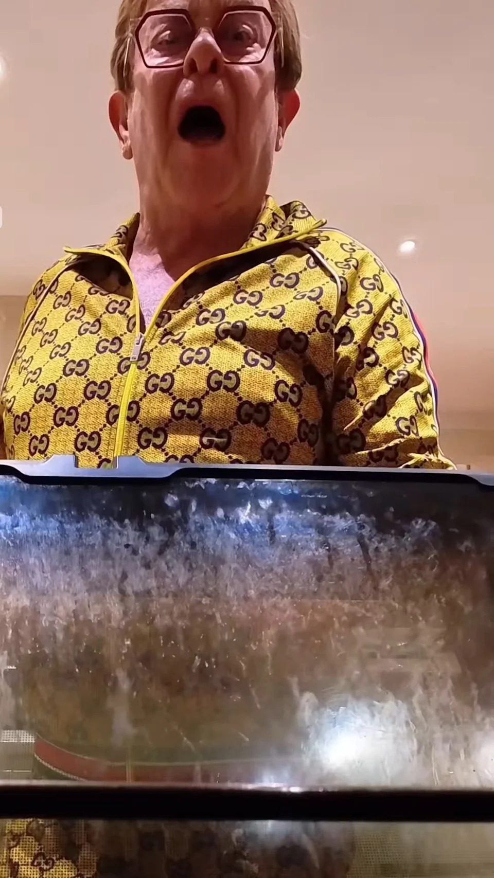 The inside of his oven window appeared covered in stains and smudges. <span class="image-credit">(eltonjohn/Instagram)</span>