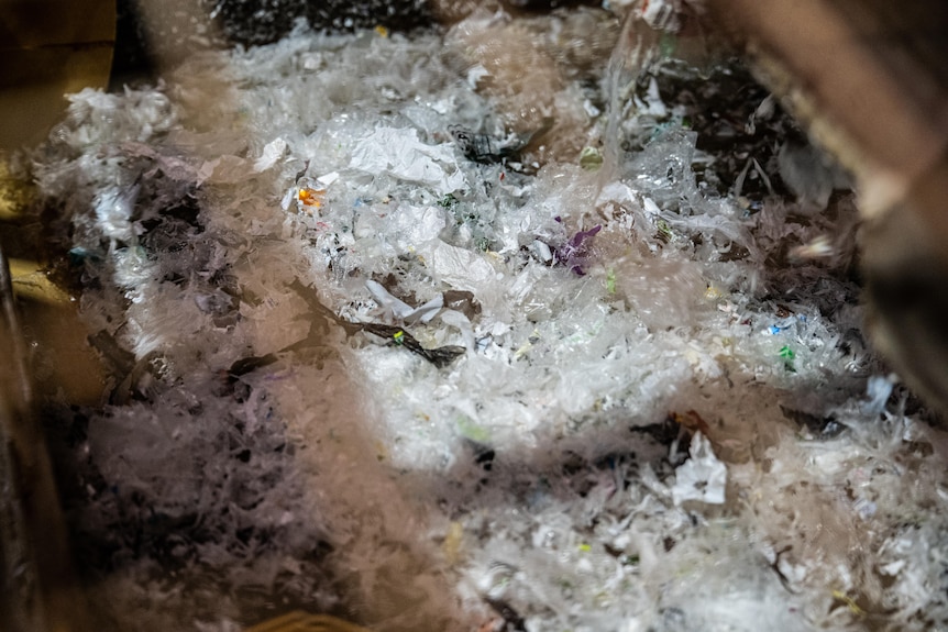 Clear white plastic on a conveyor belt. 