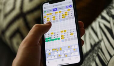 Quordle on a smartphone held in a hand