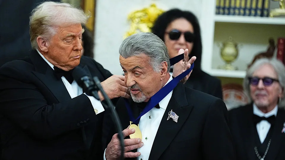 Donald Trump awarding Sylvester Stallone with the Kennedy Center honor in December 2025.