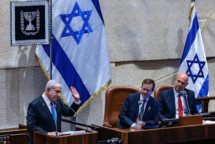 Prime Minister Benjamin Netanyahu (left), President Issac Herzog (center), and Speaker of the Knesset Amir Ohana (right) attend a session of the Knesset plenum in October.