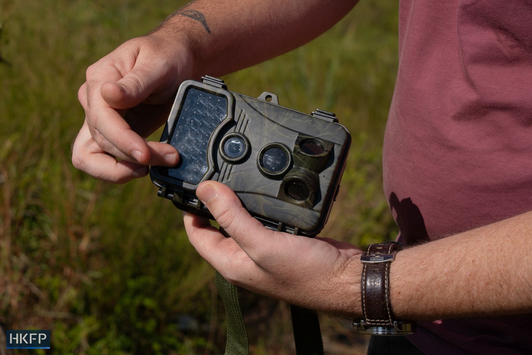Wildlife videographer Chris Owen showcases a trail camera he used to capture animal sightings in Hong Kong. Photo: Kyle Lam/HKFP. 
