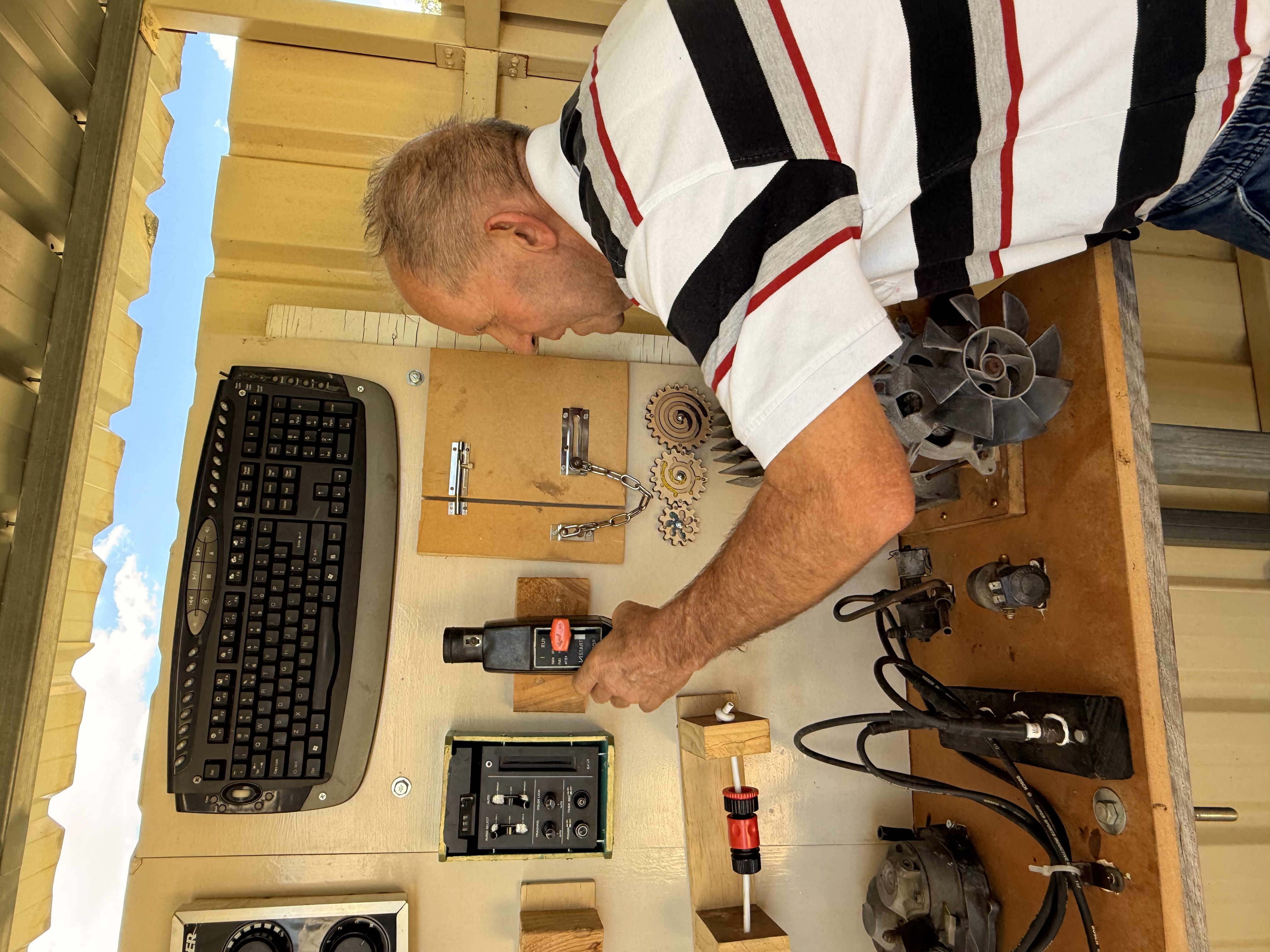 a man plays with an adult sized activity board