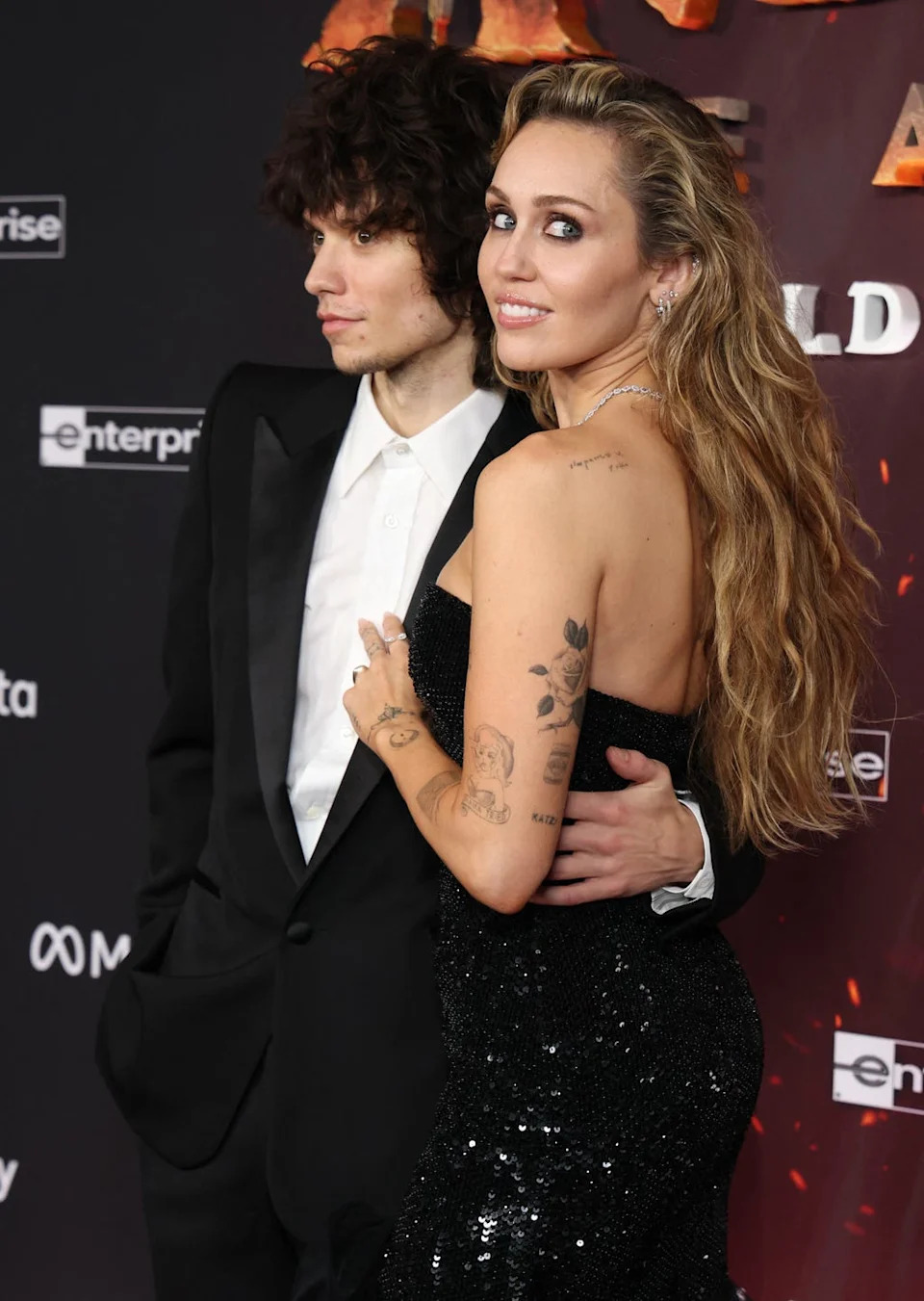 us singer actress miley cyrus and us singer maxx morando attend the premiere of disneys avatar: fire and ash at the dolby theatre in hollywood, california on december 1, 2025. (photo by valerie macon / afp via getty images)