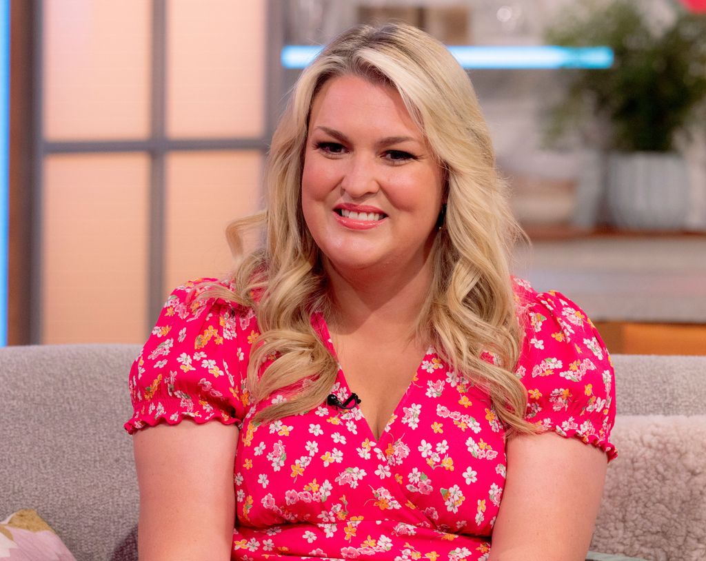 Sara Davies smiles as she sits on sofa on Lorraine