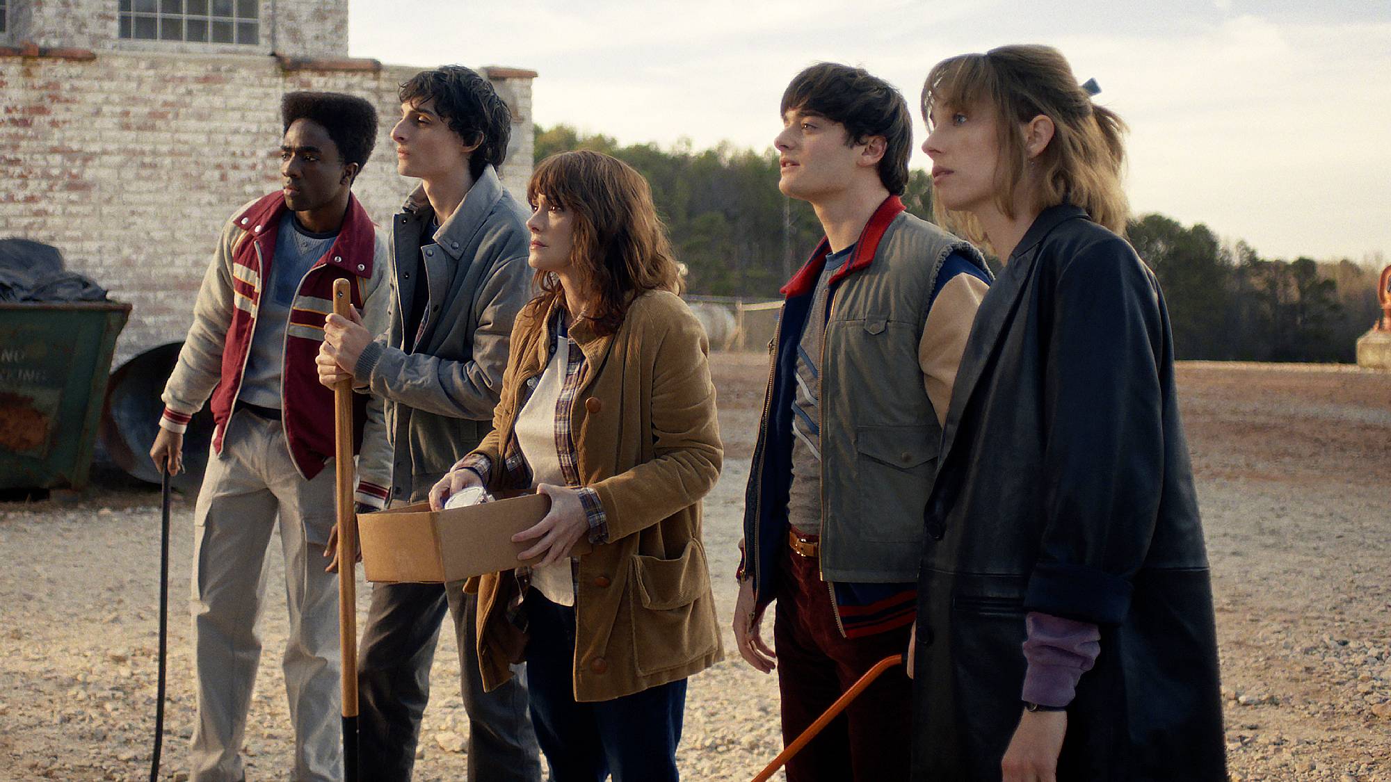Caleb McLaughlin as Lucas Sinclair, Finn Wolfhard as Mike Wheeler, Winona Ryder as Joyce Byers, Noah Schnapp as Will Byers and Maya Hawke as Robin Buckley in "Stranger Things" season 5