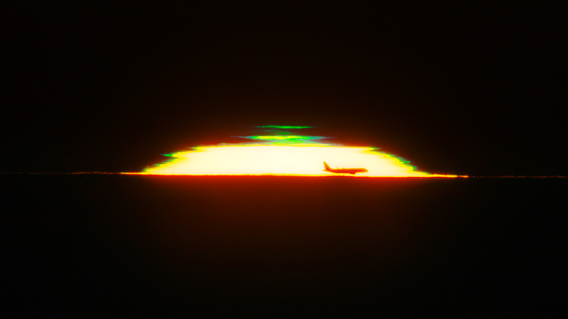The half dome of a glowing sunset is seen against a black sky with the silhouette of an airplane in the front and a green shape above it.