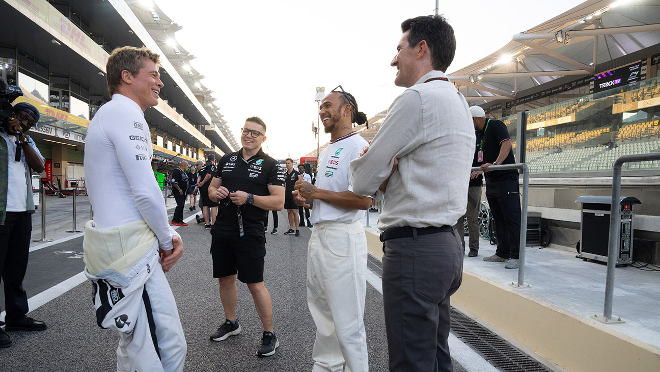 Brad Pitt, engineer Peter Bonnington, driver Lewis Hamilton and director Joseph Kosinski on the set of F1.