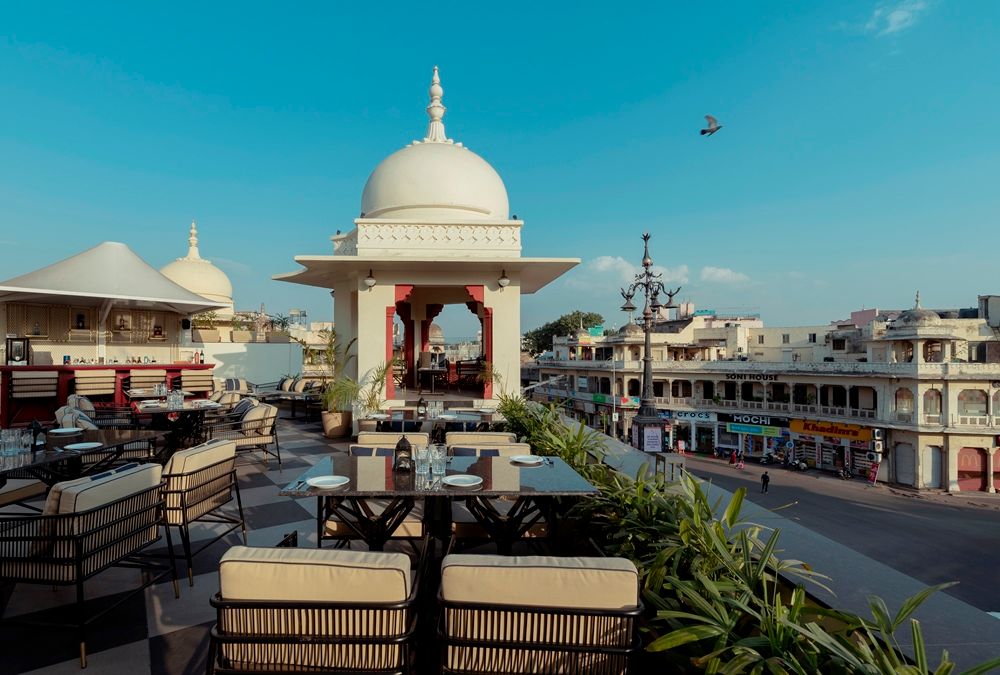 Image may contain Lamp Plant City Plate Chair Furniture Animal Bird Water Waterfront Transportation and Vehicle...