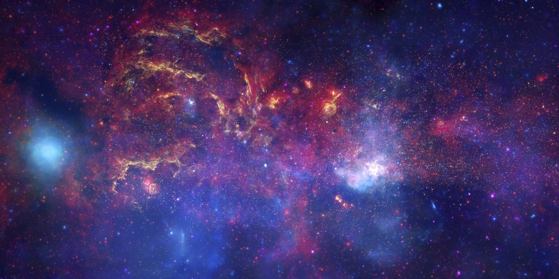 Chaotic view of swirling reds, purples and oranges on a starry indigo background, with bright hazy white spots.