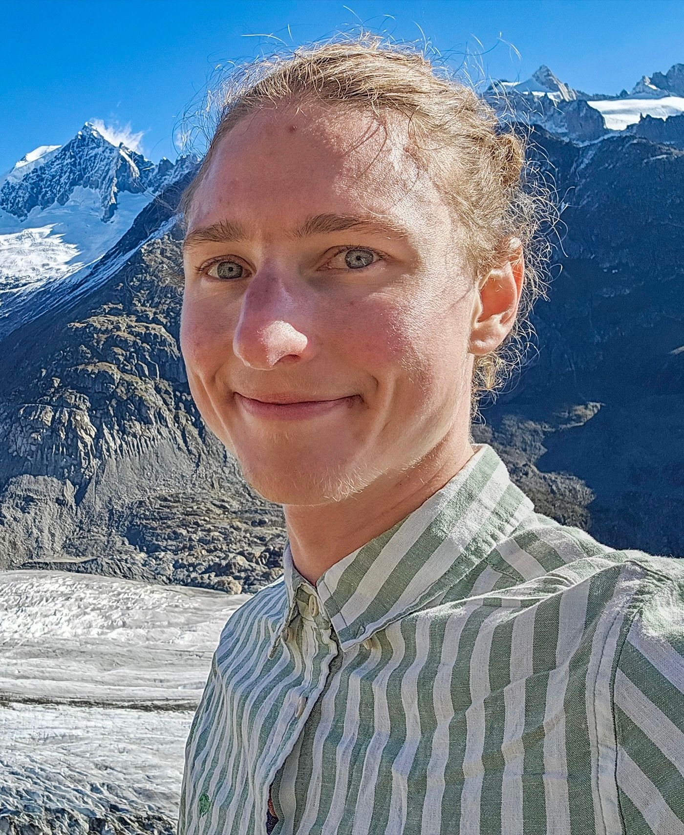 Image may contain David Nelson Blonde Hair Person Body Part Face Head Neck Happy Smile Photography and Portrait