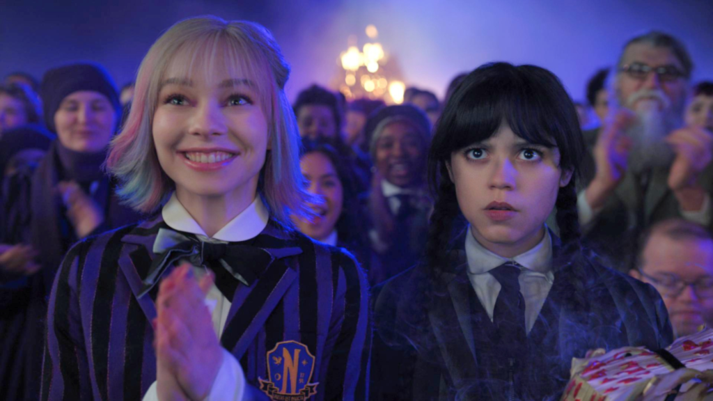 Enid smiling and Wednesday looking annoyed in Wednesday Season 2