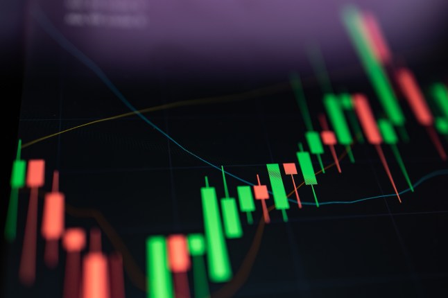 Close up growth candle graph on digital screen.