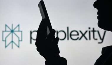 An image of a woman holding a cell phone in front of a Perplexity AI logo displayed on a computer screen.