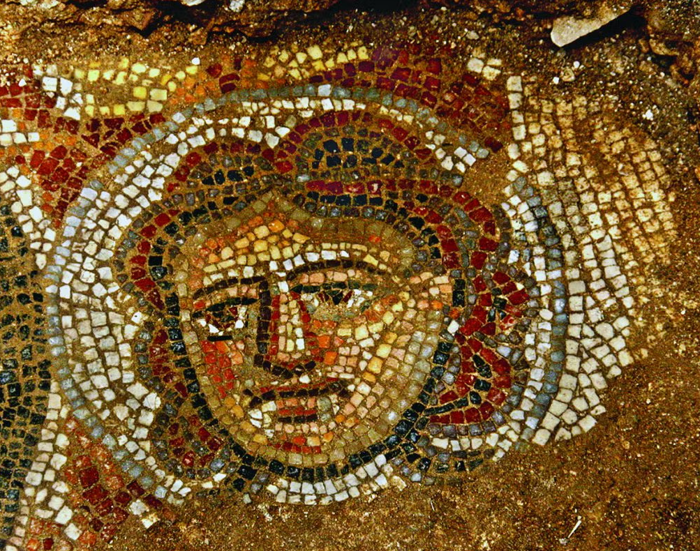 A brightly colored mosaic of a female face.