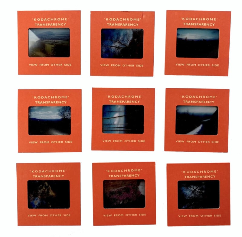 Nine vintage Kodachrome film slides in red frames are arranged in a 3x3 grid. Each slide shows a dark or moody scene, possibly outdoors or at dusk, with varying colors and shadows.