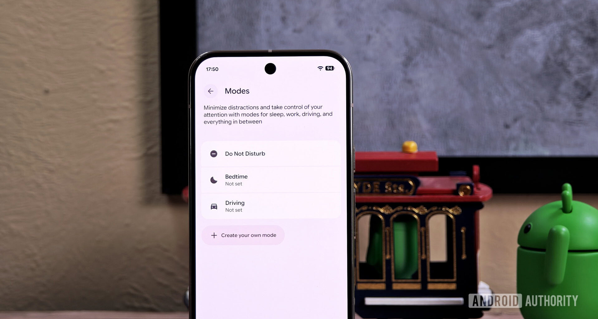 Modes settings on an Android phone with the Bot mascot in the background