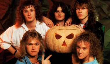 Helloween posing for a photograph with a giant pumpkin in 1988