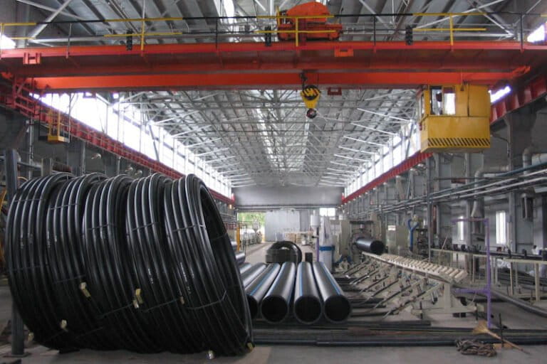 Production of PE pipes in a factory. CDR was discussed at COP30, where industrial CDR entered the official agenda as part of the objective to accelerate zero and low emission technologies in hard-to-abate sectors. Representative image by Igor Strelets via Wikimedia Commons (CC BY 3.0).