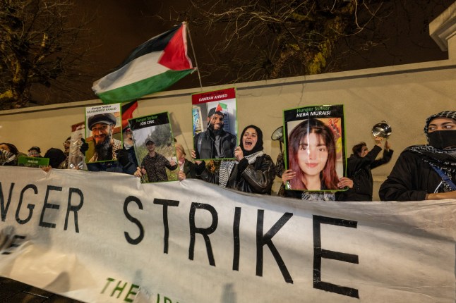 LONDON, ENGLAND - DECEMBER 18: Supporters of Palestine Action hunger strikers protest outside Pentonville prison on December 18, 2025 in London, England. Demonstrators are gathering outside Pentonville Prison in solidarity with Palestine Action (PA) prisoners on hunger strike. The group of PA prisoners have been on hunger strike for weeks, demanding the closure of Elbit Systems sites in the UK, the lifting of the government's proscription against Palestine Action, and the right to fair trials. (Photo by Guy Smallman/Getty Images)