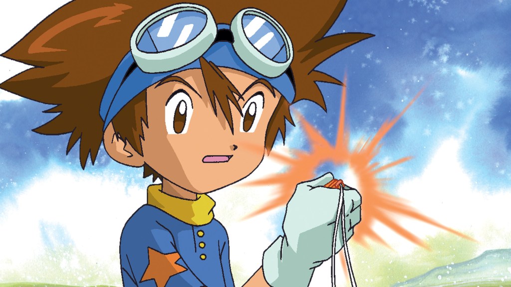 Tai holding a crest and looking shocked in Digimon Adventure